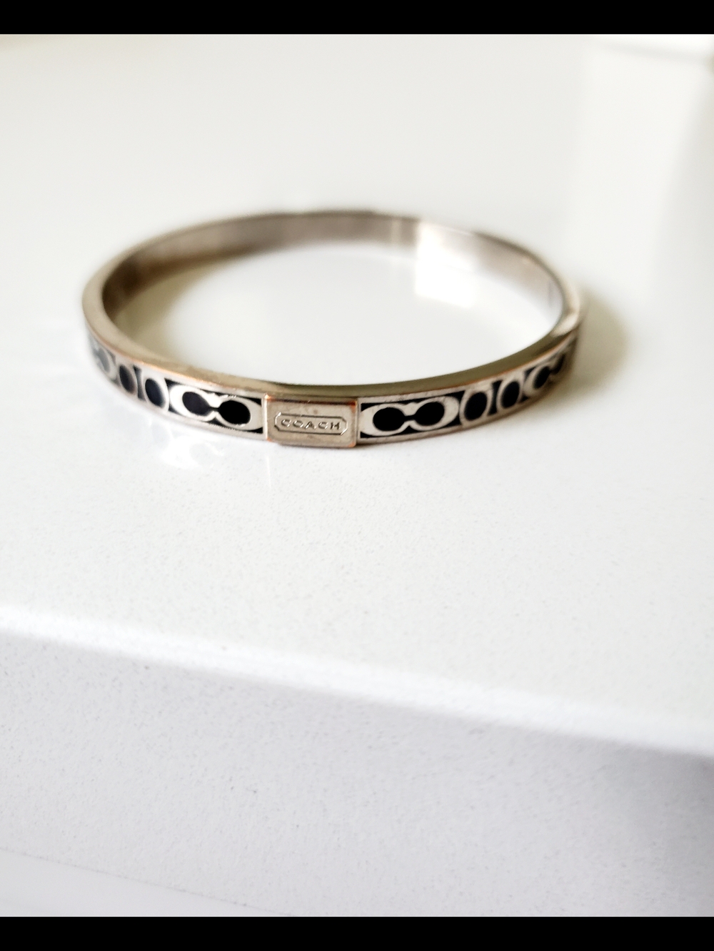 Coach Silver-Tone Bangle with Black Enamel Accents